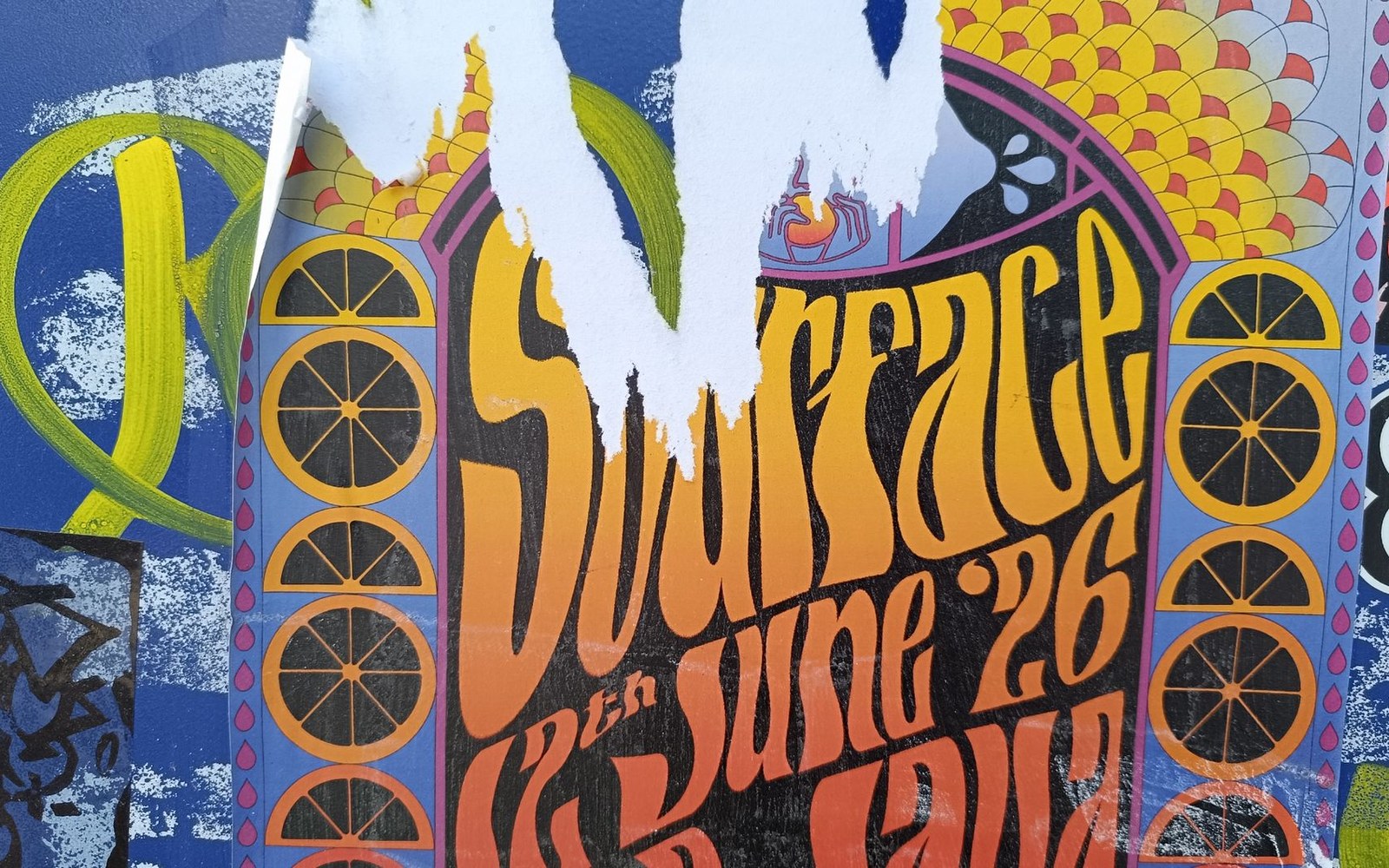 Torn psychedelic concert poster with swirling lettering advertising a June 26th show